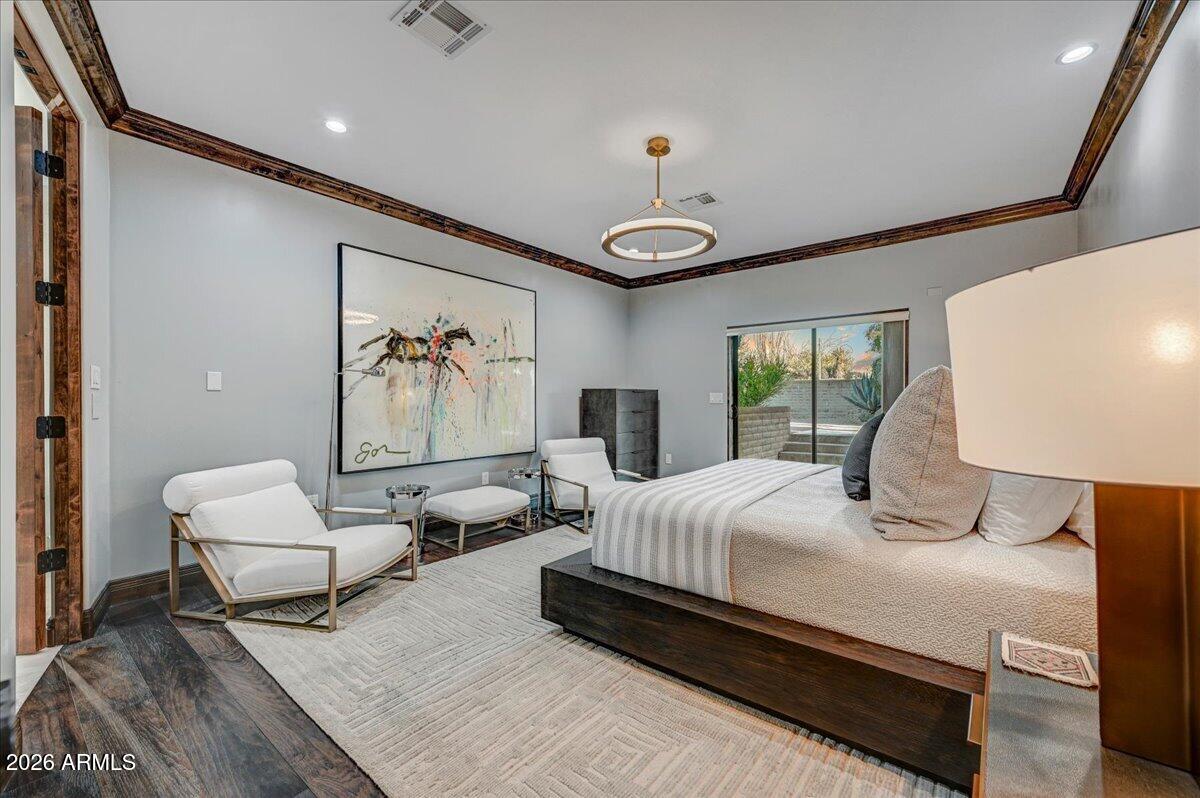 8343 East Spanish Boot Road Carefree, AZ 85377 - Photo 33 of 71 a bedroom with a large bed and a window