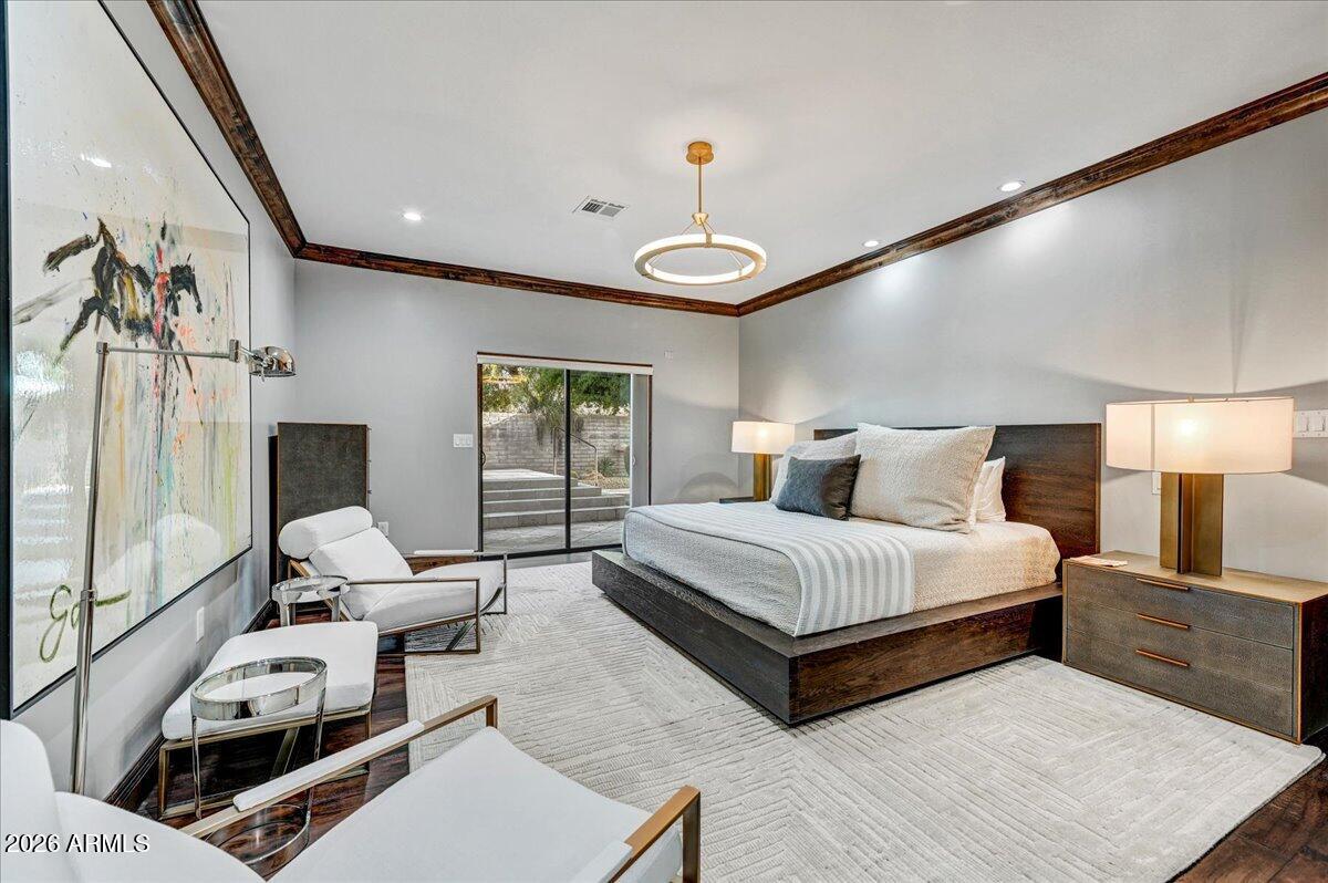 8343 East Spanish Boot Road Carefree, AZ 85377 - Photo 34 of 71 a spacious bedroom with a bed and window