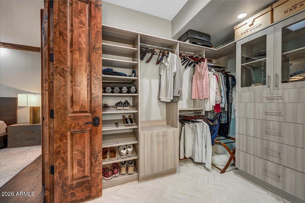 8343 East Spanish Boot Road Carefree, AZ 85377 - Photo 37 of 71 a view of walk in closet with clothes and shoes