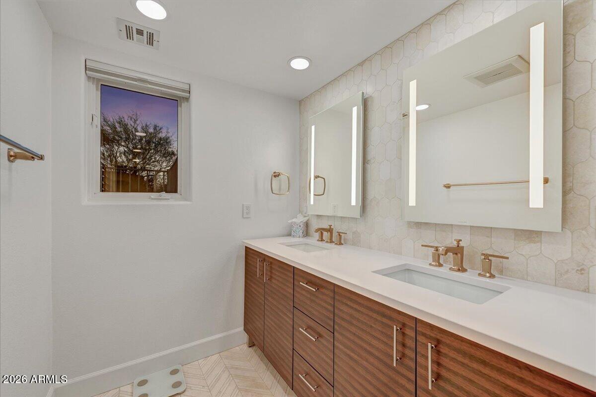 8343 East Spanish Boot Road Carefree, AZ 85377 - Photo 46 of 71 a bathroom with a double vanity sink and a mirror