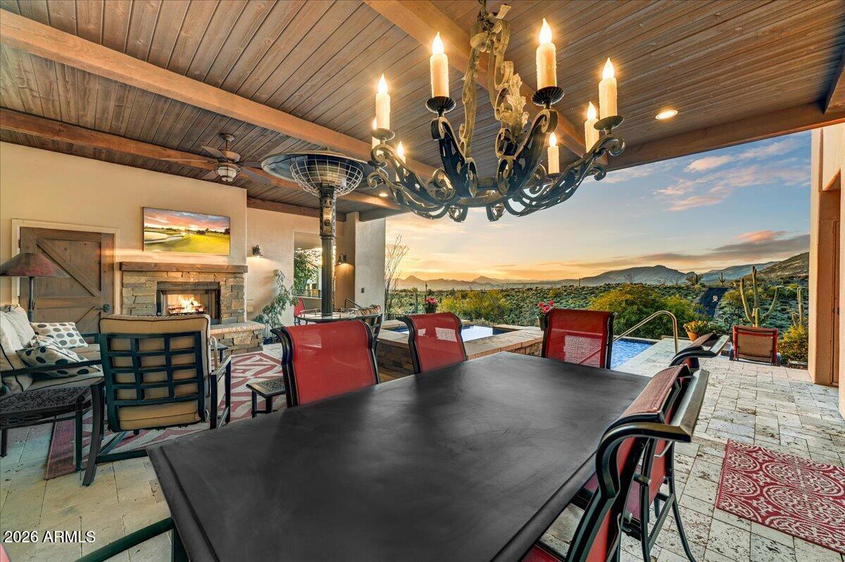 8343 East Spanish Boot Road Carefree, AZ 85377 - Photo 48 of 71 a view of a patio with dining table and chairs