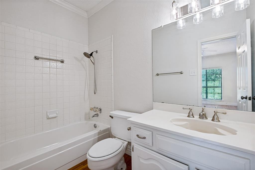 7055 Inwood Road Dallas, TX 75209 - Photo 21 of 24 a bathroom with a sink a toilet and a bathtub
