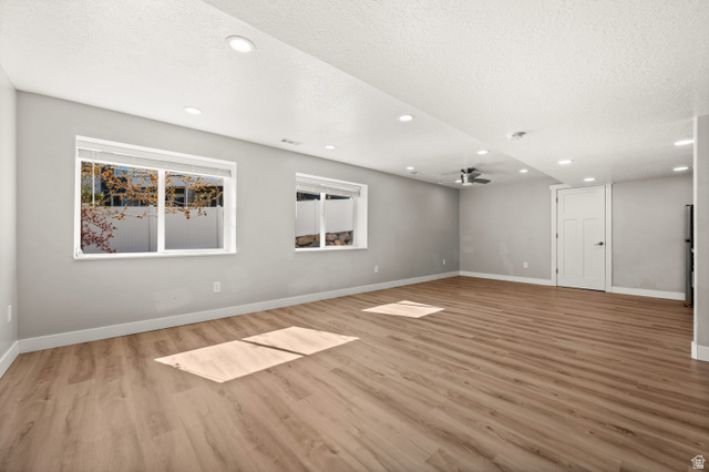 14728 South Canyon Pointe Road Draper, UT 84020 - Photo 27 of 35 Spacious room featuring wood-finish flooring, recessed lighting, and a contemporary ceiling fan