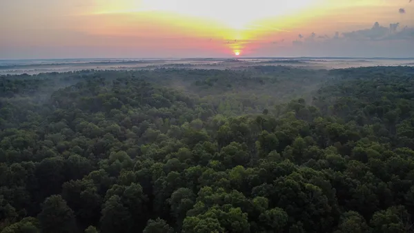 a view of an outdoor space and a lake view in back