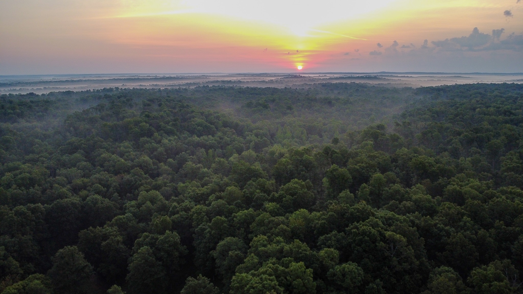 a view of an outdoor space and a lake view in back