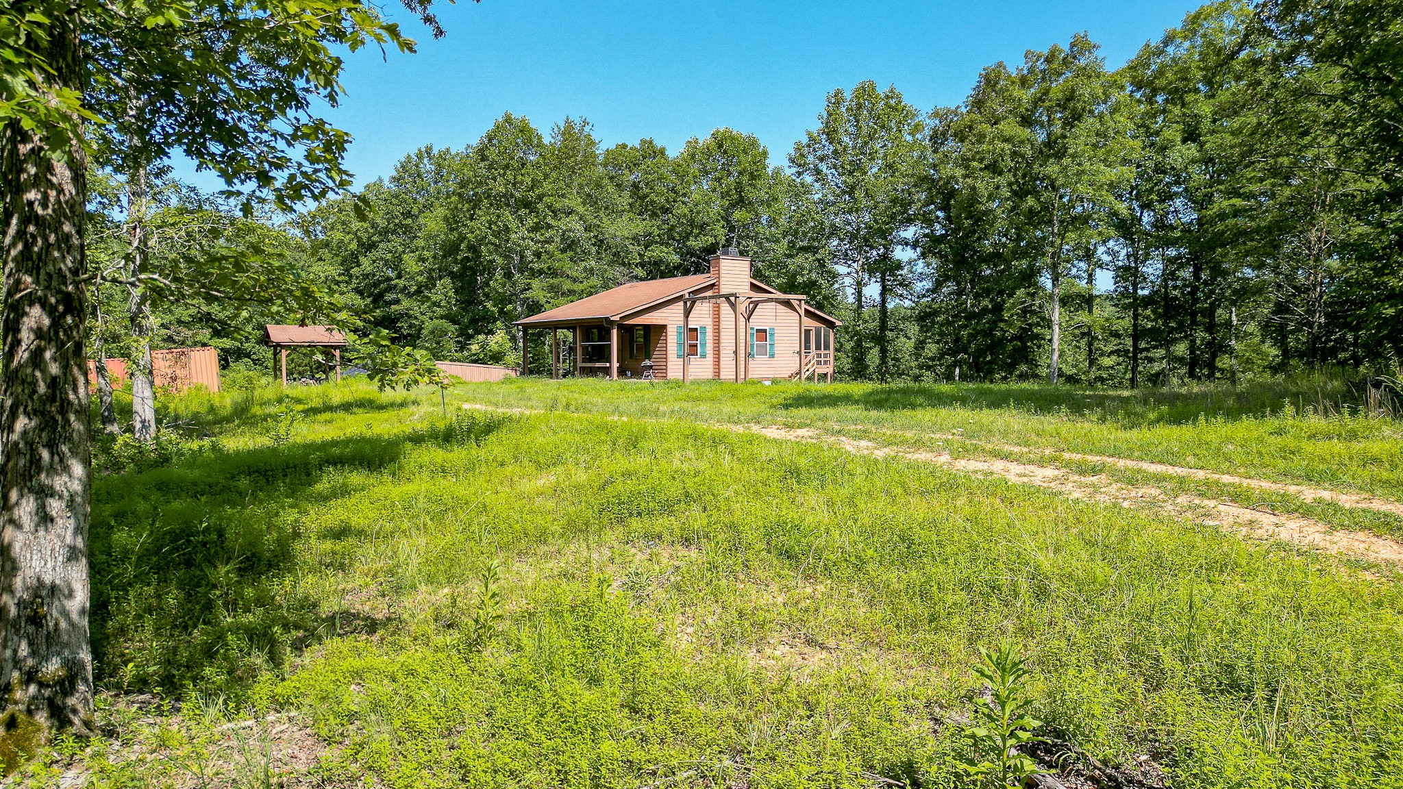 0 Highway 230 McEwen, TN 37101 - Photo 9 of 48 a front view of a house with a yard