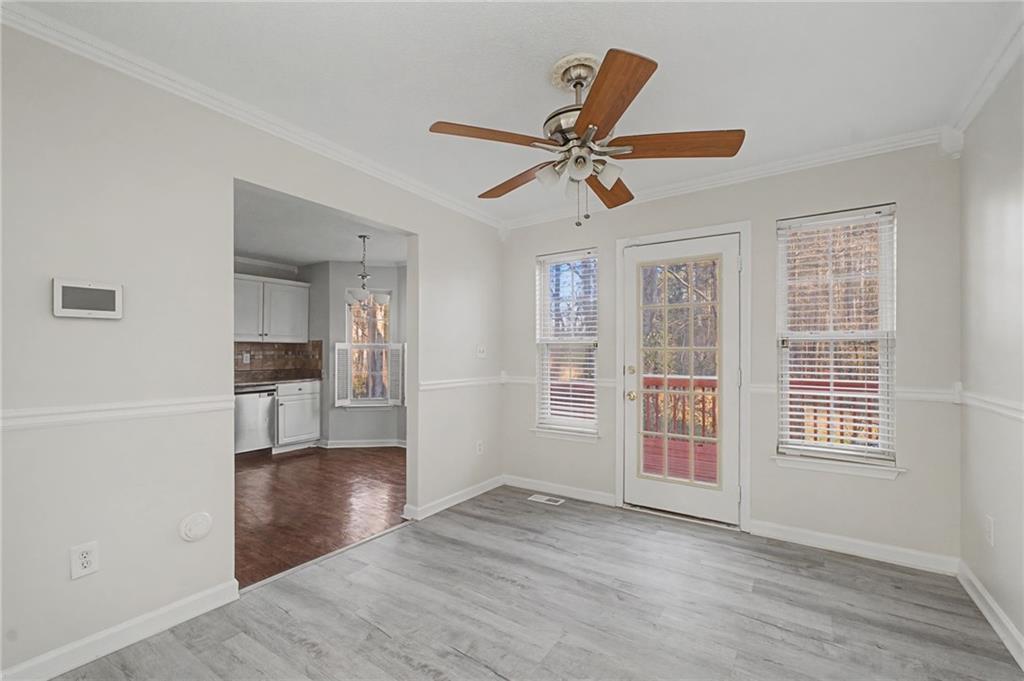 4244 Akins Ridge Lane Powder Springs, GA 30127 - Photo 11 of 37 wooden floor in an empty room with a window