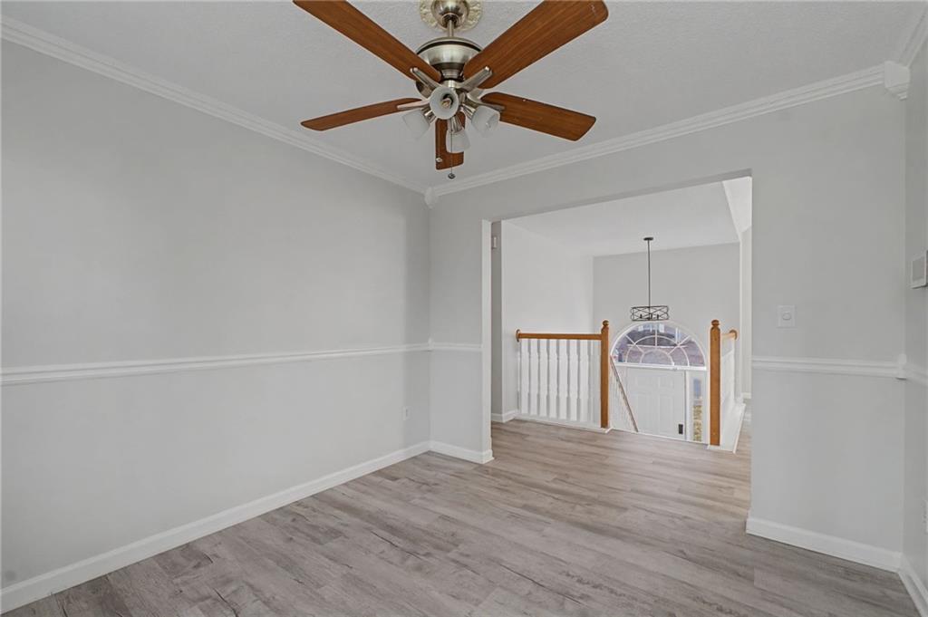 4244 Akins Ridge Lane Powder Springs, GA 30127 - Photo 12 of 37 a view of empty room with wooden floor
