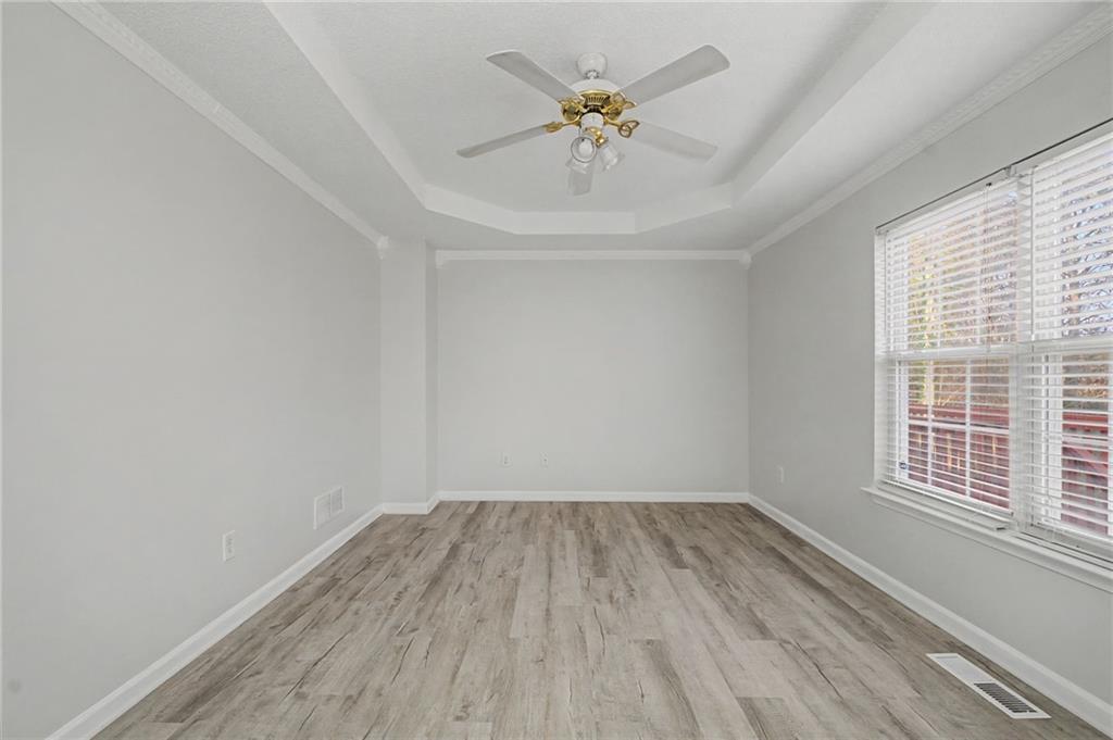 4244 Akins Ridge Lane Powder Springs, GA 30127 - Photo 19 of 37 wooden floor in an empty room with a window