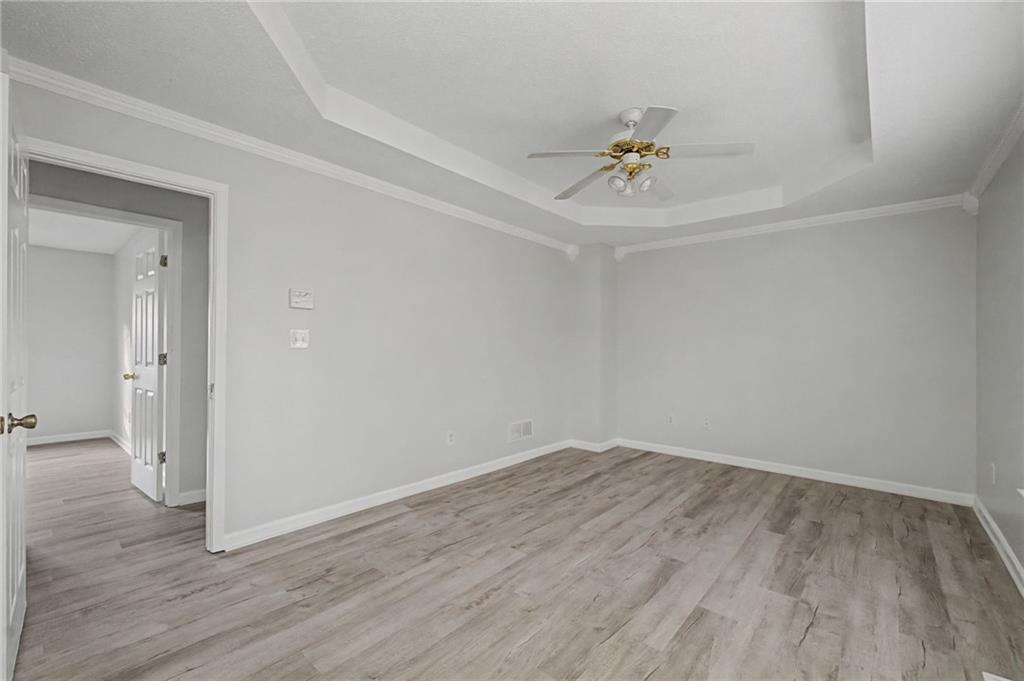 4244 Akins Ridge Lane Powder Springs, GA 30127 - Photo 20 of 37 wooden floor in an empty room with a window
