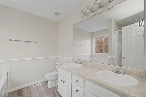 a white bath tub sitting next to a window