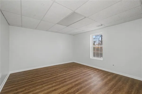 a view of room with wooden floor