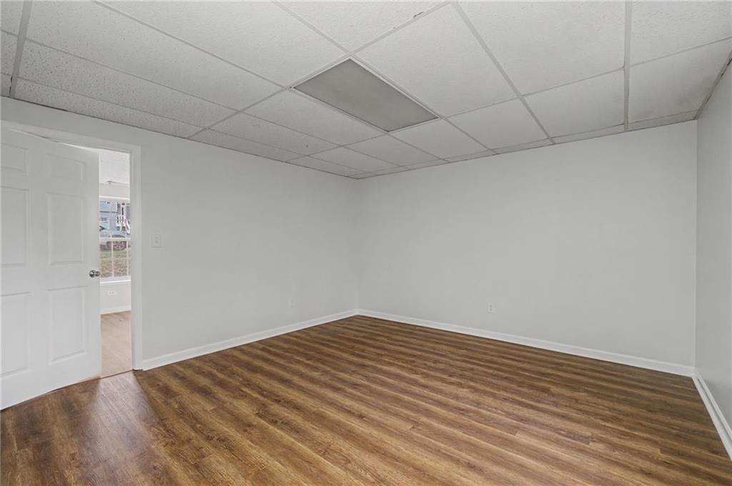 4244 Akins Ridge Lane Powder Springs, GA 30127 - Photo 32 of 37 a view of room with wooden floor