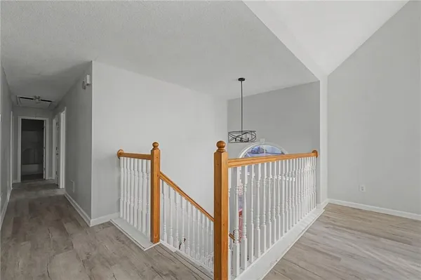a view of a hallway with stairs