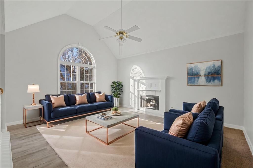 4244 Akins Ridge Lane Powder Springs, GA 30127 - Photo 10 of 37 a living room with furniture and a large window