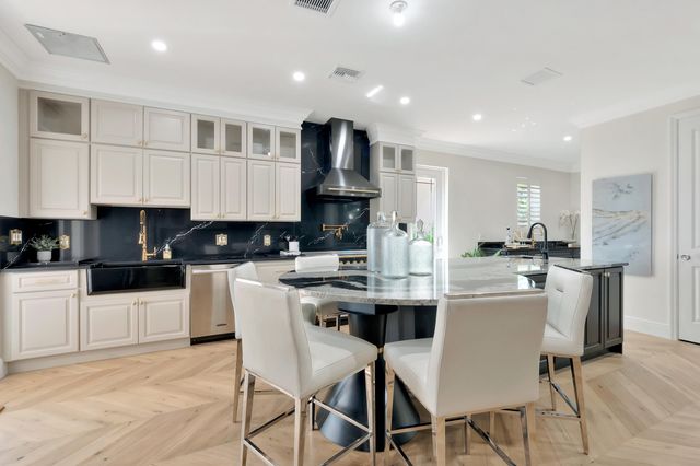 a bathroom with a sink a toilet a mirror and shower curtain