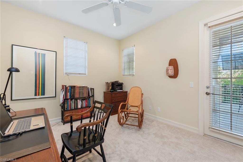 4852 West Blvd Court Naples, FL 34103 - Photo 16 of 18 a view of a livingroom with furniture and a window