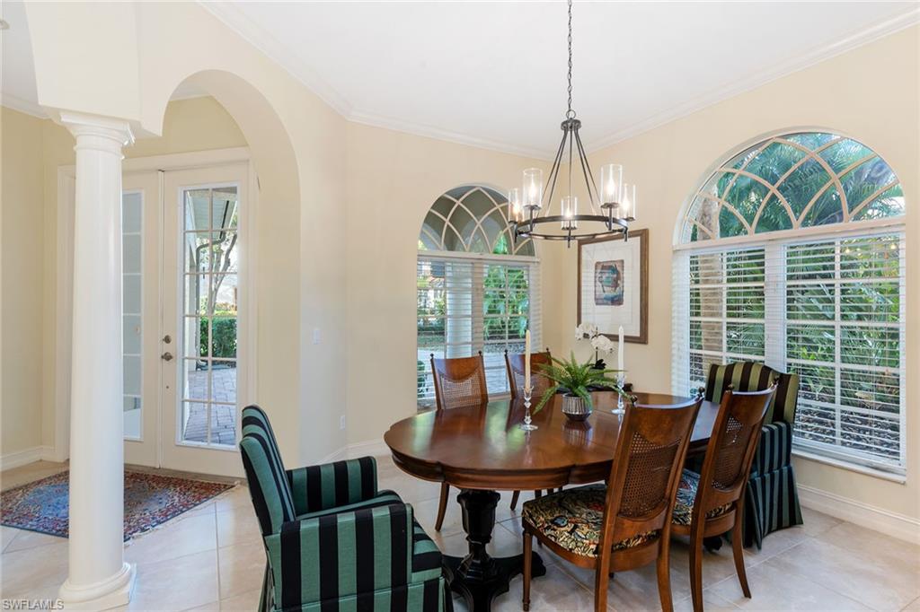 4852 West Blvd Court Naples, FL 34103 - Photo 8 of 18 a view of a dining room with furniture window and wooden floor