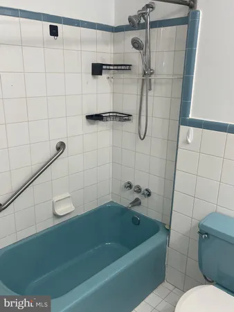 a bathroom with a shower and toilet