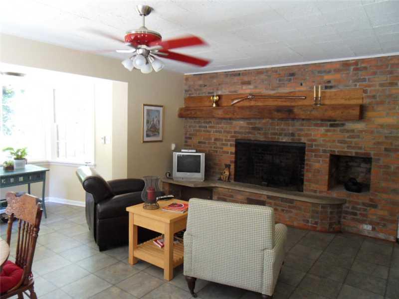136 Red Arrow Road Ligonier, PA 15658 - Photo 4 of 25 Other. Gathering Room... Gas Fireplace with wooden beam mantel and bay window.