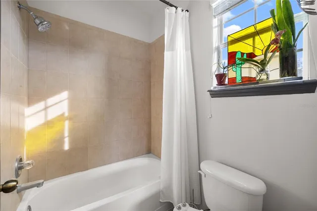 a bathroom with a toilet a sink and a bathtub