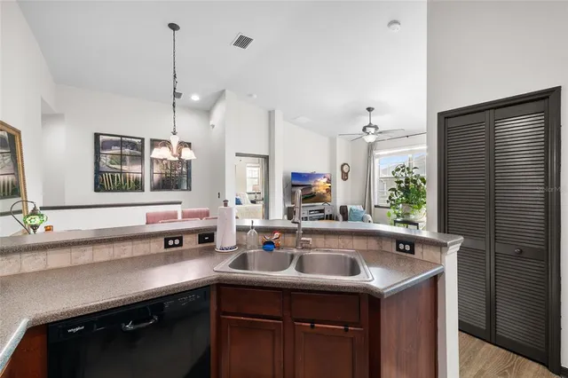 a kitchen with a sink and a window