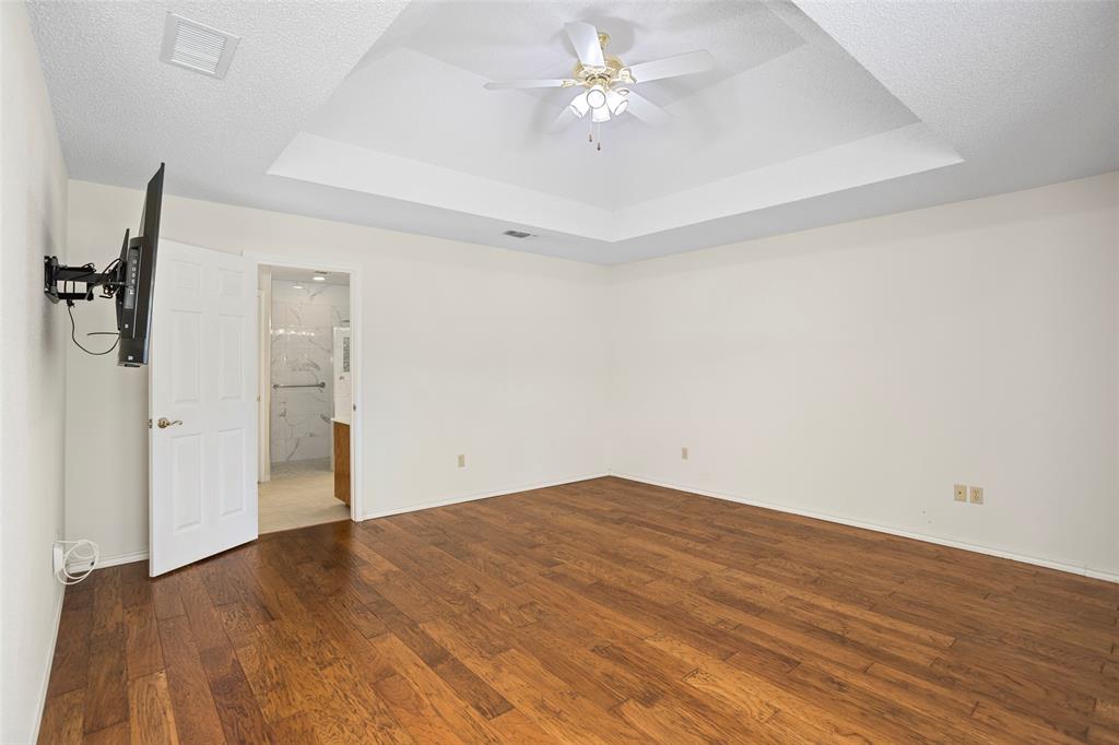 5522 Wedgefield Road Granbury, TX 76049 - Photo 14 of 22 wooden floor in an empty room
