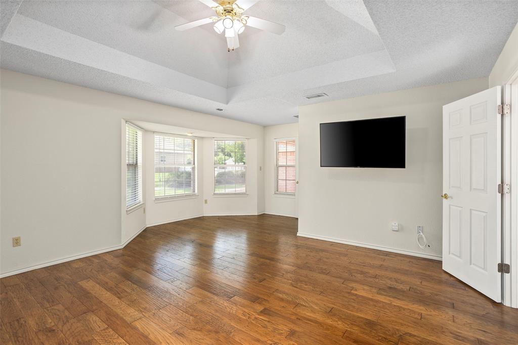 5522 Wedgefield Road Granbury, TX 76049 - Photo 15 of 22 an empty room with wooden floor and windows