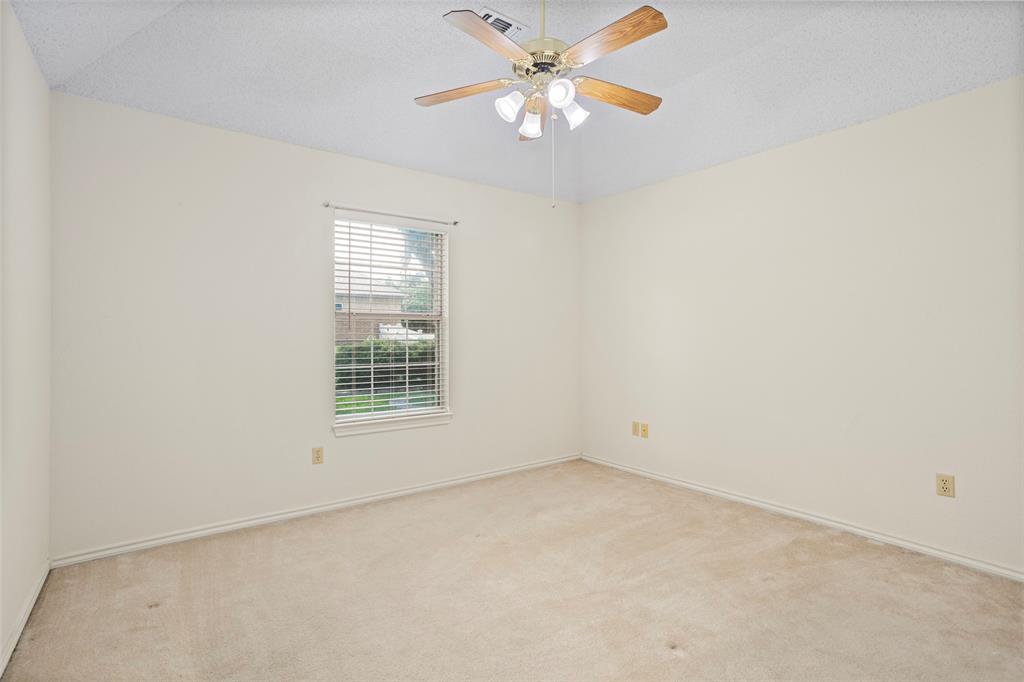 5522 Wedgefield Road Granbury, TX 76049 - Photo 19 of 22 an empty room with a window and a fan
