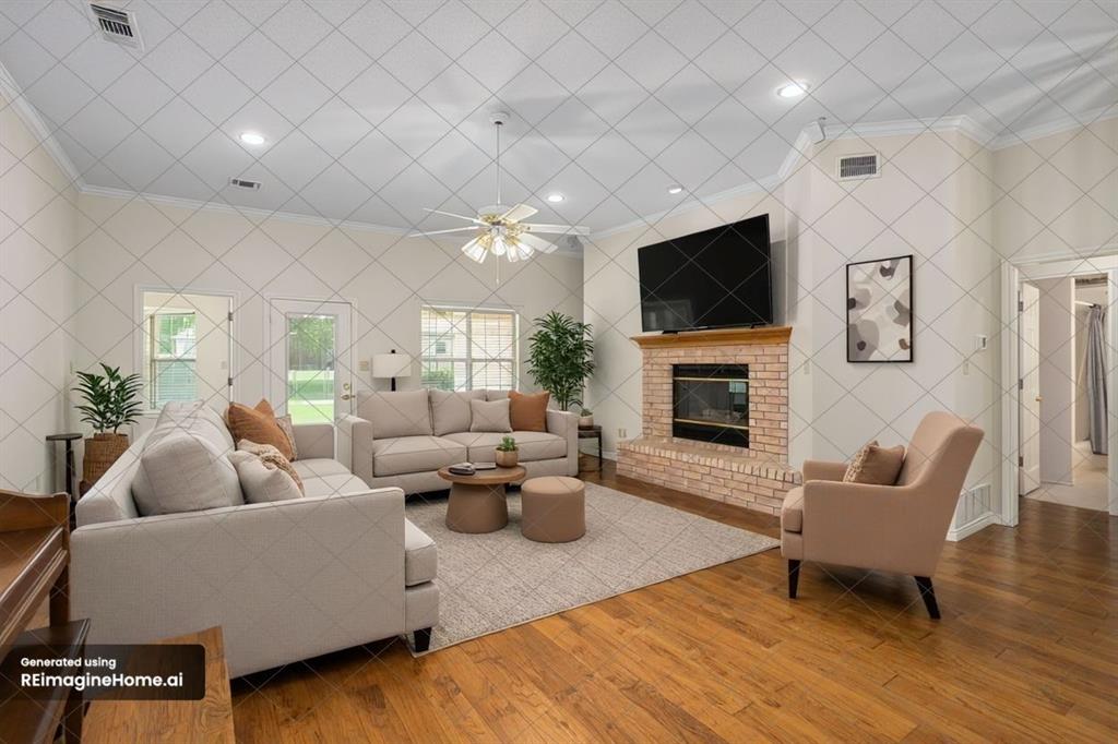 5522 Wedgefield Road Granbury, TX 76049 - Photo 4 of 22 a living room with furniture a flat screen tv and a fireplace