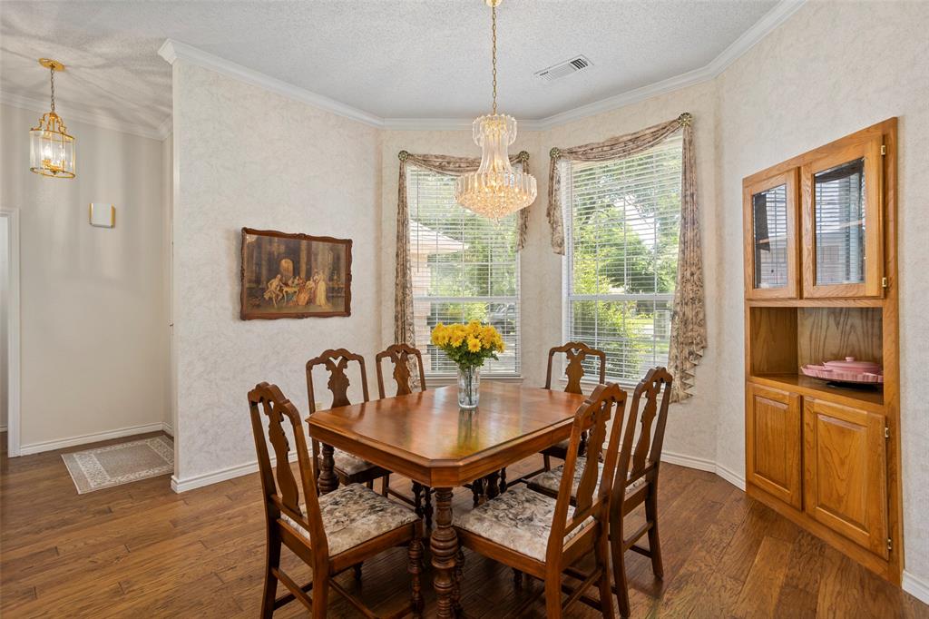 5522 Wedgefield Road Granbury, TX 76049 - Photo 6 of 22 a view of a dining room with furniture window and wooden floor