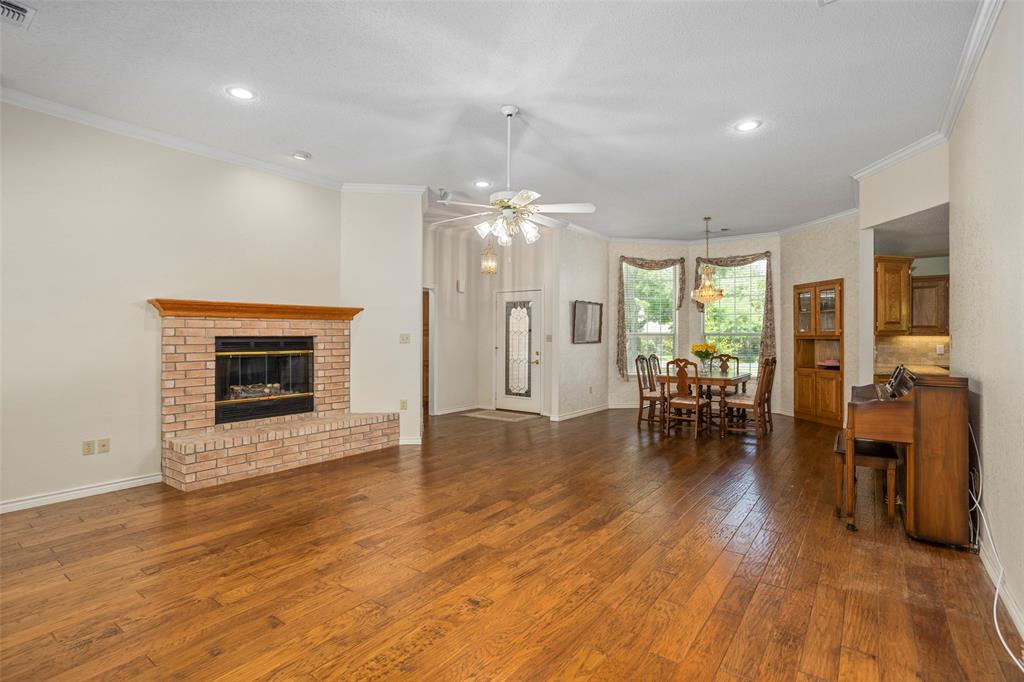 5522 Wedgefield Road Granbury, TX 76049 - Photo 7 of 22 a view of a livingroom with furniture a fireplace