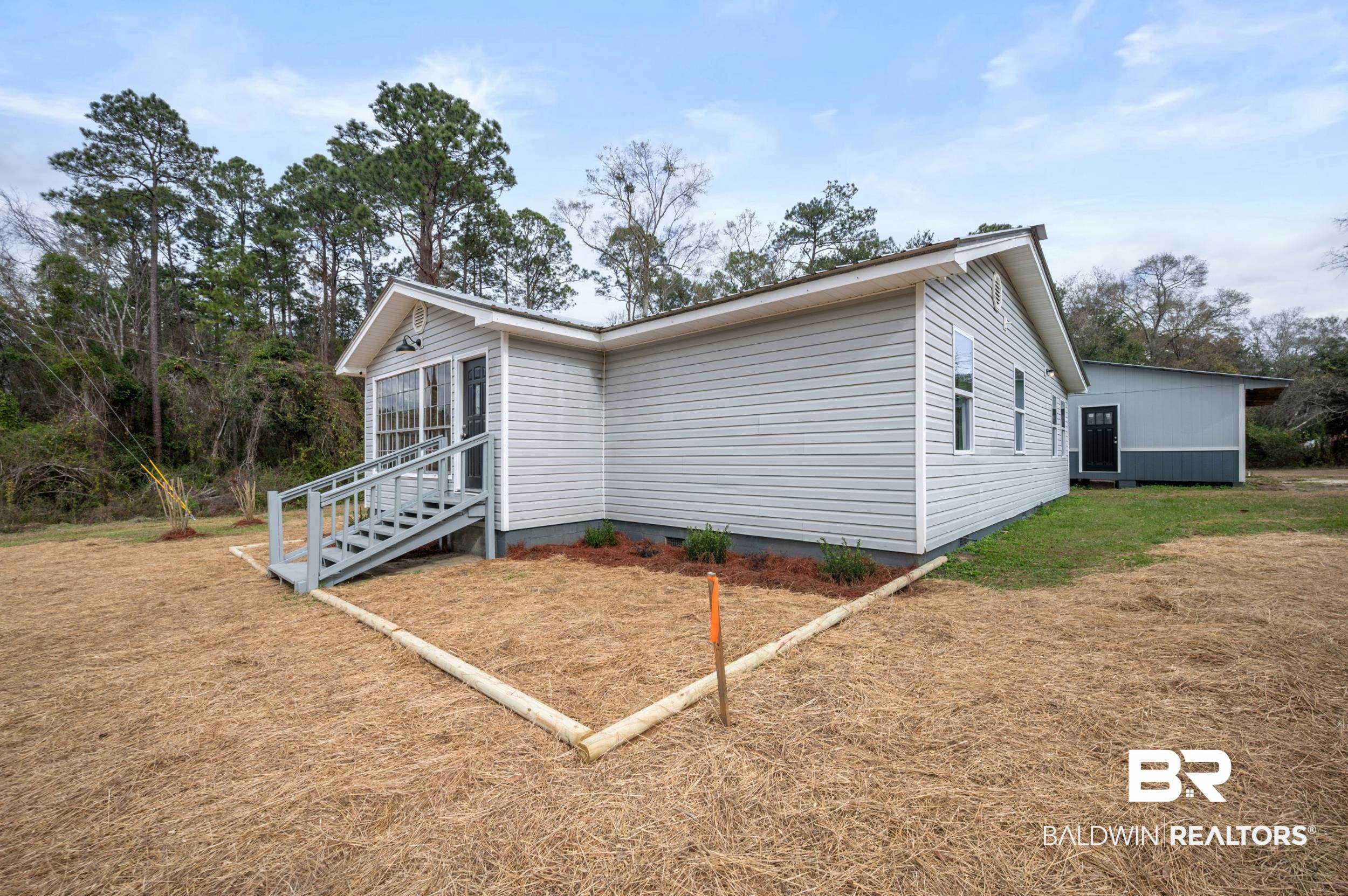 35780 Spring Road North Stapleton, AL 36578 - Photo 3 of 41 View of side of home with a lawn