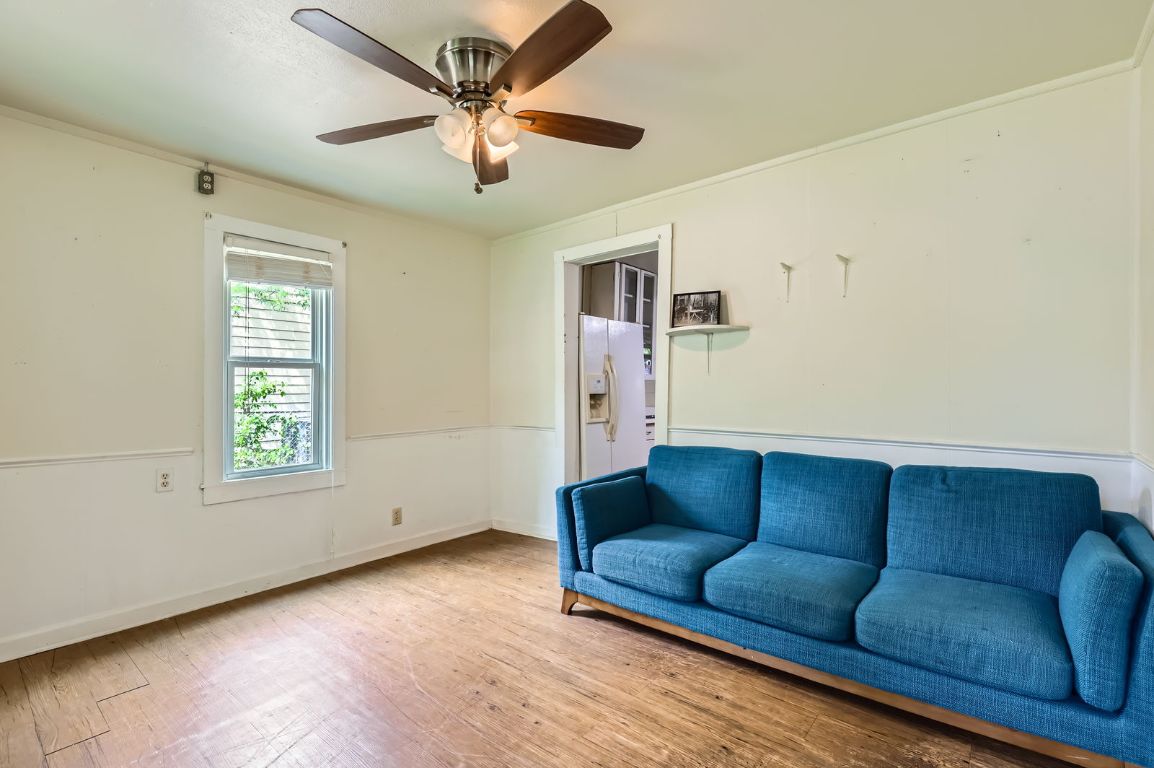 1313 Perez Street Austin, TX 78721 - Photo 2 of 8 a living room with furniture and a window