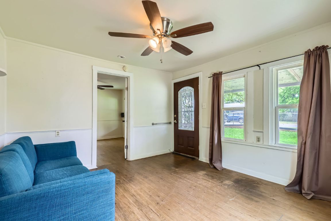 1313 Perez Street Austin, TX 78721 - Photo 3 of 8 a living room with furniture and a large window