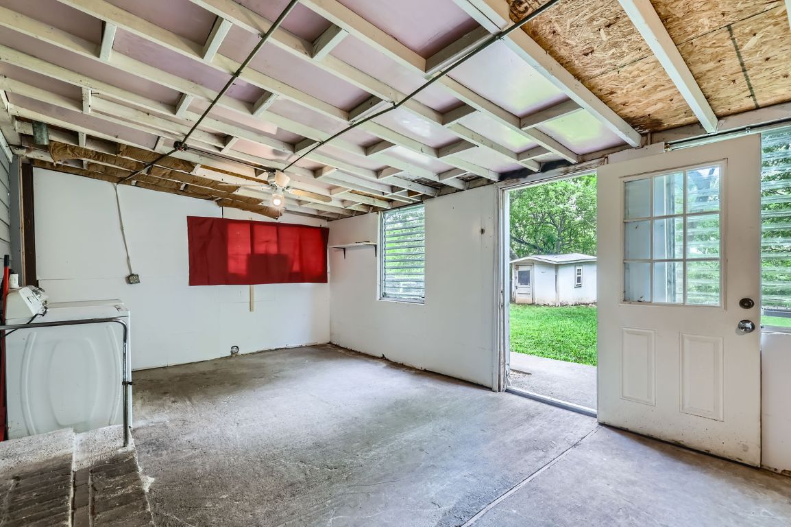 1313 Perez Street Austin, TX 78721 - Photo 6 of 8 a view of a room with wooden walls