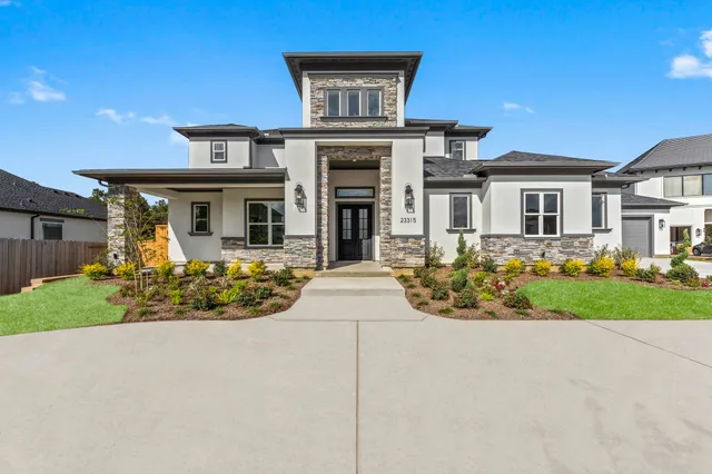 front view of a house with a yard