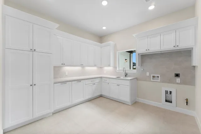 a kitchen with a sink and cabinets