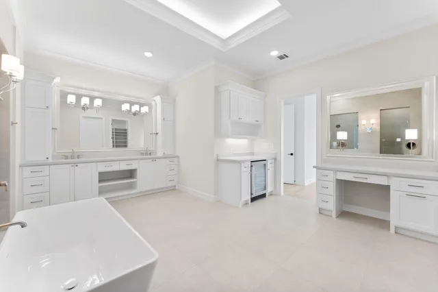 a view of a workspace with wooden floor and a ceiling fan