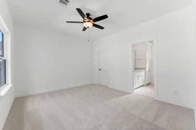 a bathroom with a sink and a mirror with window