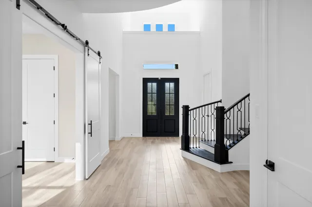 a view of a livingroom with a ceiling fan and window