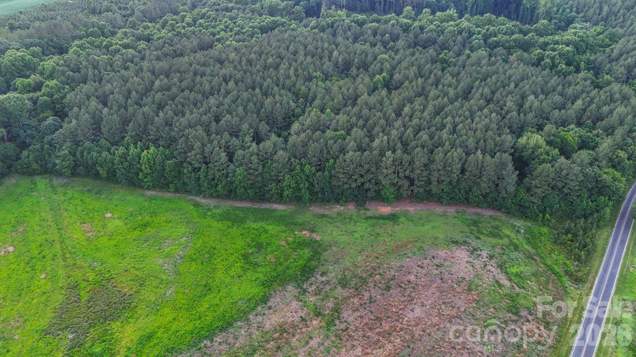 0 Lucy Short Cut Road, Unit 2 Marshville, NC 28103 - Photo 26 of 38 a view of a yard with a trees
