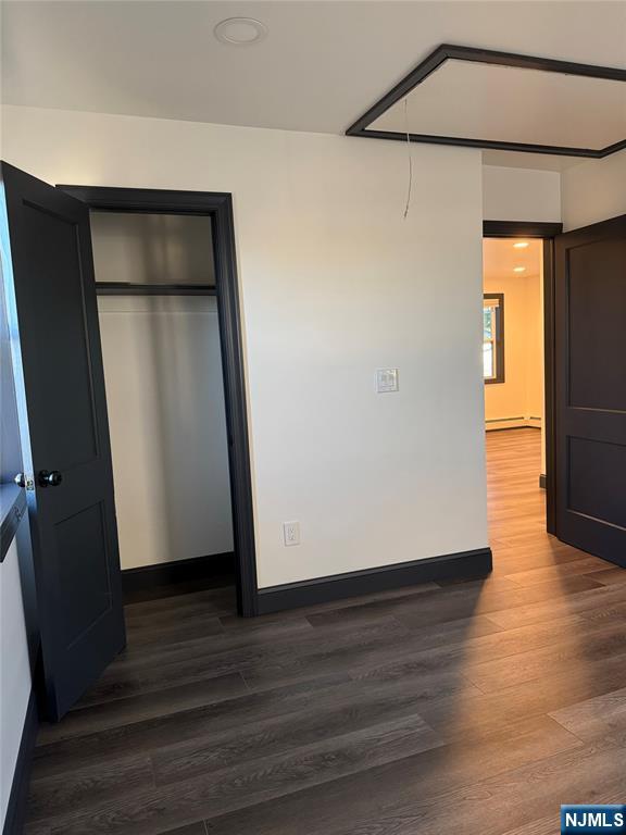 27 Emerald Street Hackensack, NJ 07601 - Photo 18 of 42 an empty room with wooden floor and closet