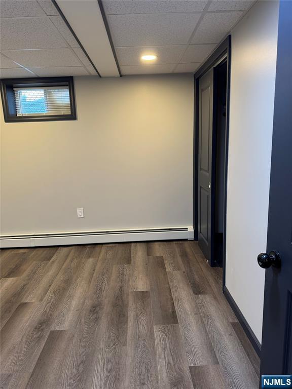 27 Emerald Street Hackensack, NJ 07601 - Photo 24 of 42 a view of an empty room with wooden floor