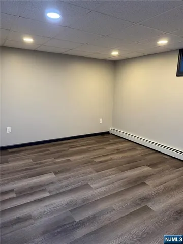 an empty room with wooden floor