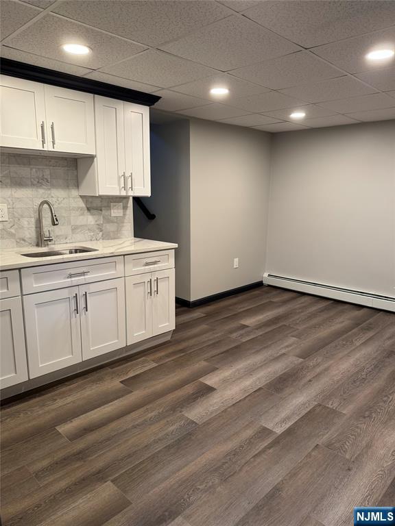 27 Emerald Street Hackensack, NJ 07601 - Photo 28 of 42 a kitchen with granite countertop white cabinets and a sink