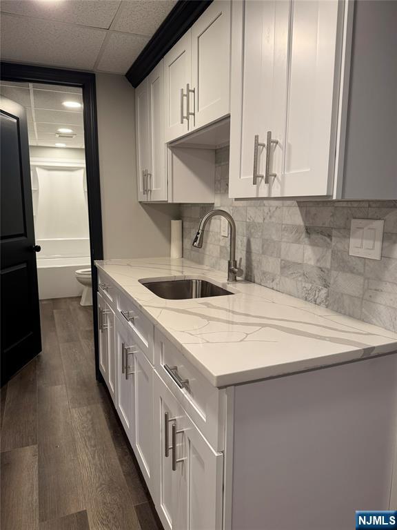 27 Emerald Street Hackensack, NJ 07601 - Photo 29 of 42 a kitchen with stainless steel appliances a sink a stove and a refrigerator with wooden floor