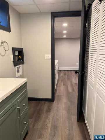 a view of a bathroom with a sink dryer and washer