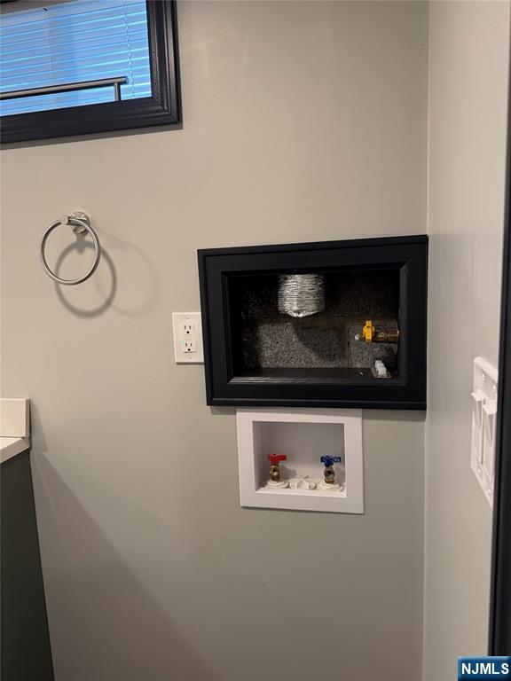 27 Emerald Street Hackensack, NJ 07601 - Photo 32 of 42 a close view of a washer and dryer