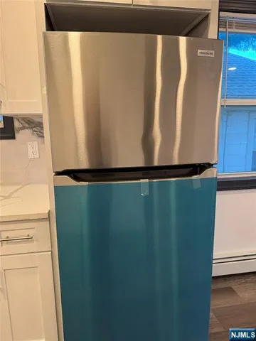 a close view of sink and washing machine